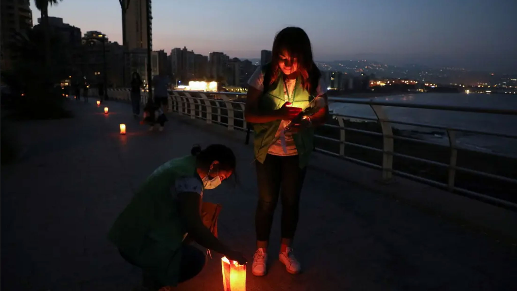 As Lebanon’s crises weigh heavy, people light candles in suicide prevention walk